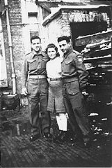 A Jewish Brigade soldier with two members of "Kibbutz...