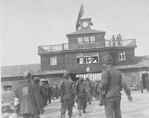 American soldiers and liberated prisoners at the main...