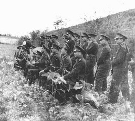A Romanian firing squad prepares to execute former...