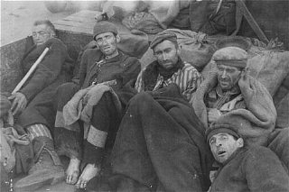 Survivors of the Wöbbelin camp wait for evacuation...