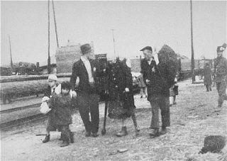 Jews bound for the rail station during deportation...