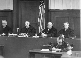 The four judges of Military Tribunal III hearing the...