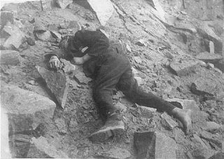 A Soviet inmate lies dead in the Mauthausen concentration...