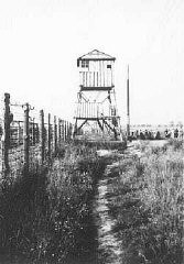 View of watchtower and fence at the Majdanek camp...