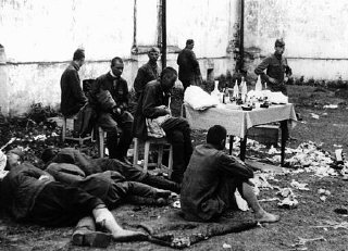 Wounded Soviet prisoners of war await medical atten...
