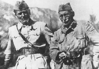 Yugoslav partisan leaders Josip Broz Tito (left) and...