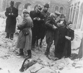 Families and friends of Jewish victims killed in the...