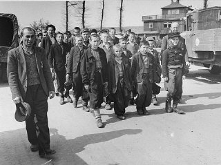 Children march out of Buchenwald to a nearby American...