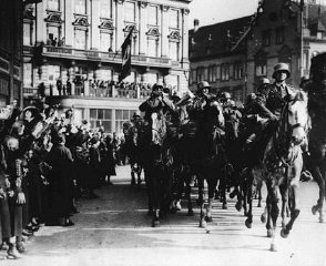 German citizens cheer the entry of German forces into...