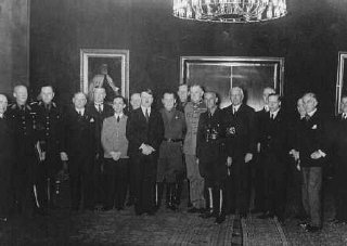 Adolf Hitler poses with his cabinet shortly after assuming...