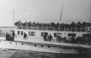 Thracian Jews crowd the upper deck of a deportation...