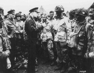 General Dwight D. Eisenhower visits with paratroopers...