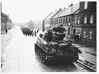 An American tank follows German civilians from Gardelegen...