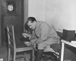 Hermann Goering eats breakfast in his cell while awaiting...