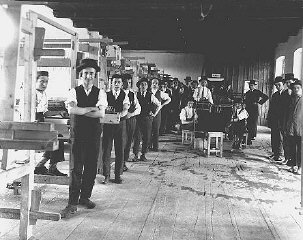 Prewar photograph of students in a weaving workshop...