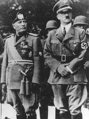 Benito Mussolini and Adolf Hitler stand together on...