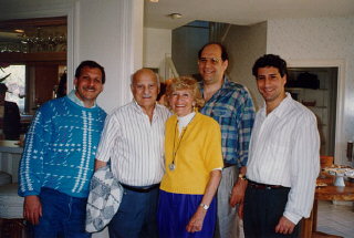 Lisa and Aron (center) with their three sons, Gordon...