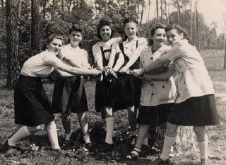 Regina (third from left) with friends while at the...