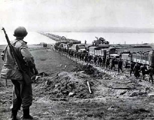 German prisoners file across the Rhine as American...