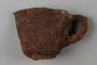Rusted, crushed cup recovered from Chelmno killing center