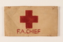 White armband printed with a red cross and F.A.Chief