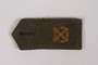 Olive shoulder board with gold crossed swords acquired by US soldier