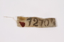 White cloth badge with his prisoner number owned by a Belgian Jewish man deported to slave labor camps