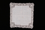 Embroidered white handkerchief with floral lace border brought with a Polish Jewish emigre