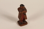 Figurine of a man in folk costume playing a clarinet brought to the US by a Jewish refugee from prewar Germany