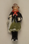Miniature figurine in Bavarian dress with a fish for charity campaign donors