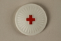 White pin with a red cross