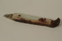 Mother-of-pearl lever arm of a nail clipper used in a concentration camp