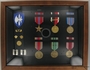 Framed shadow box of military medals and ribbons awarded to a US Army Captain