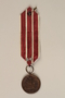 Medal and maroon and white ribbon