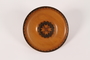 Decorative wooden plate with paint and inlay