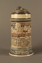 Gray and blue beer stein with images of anti-Jewish fables and politicians