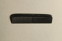 Black plastic comb inside black leather case