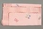 Embroidered pink tablecloth with a floral design owned by a Romanian Jewish woman
