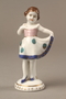 Porcelain figurine of a young girl in a white dress given to a Ukrainian Jewish family