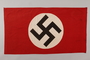 Nazi banner with a swastika on a white circle acquired by a US soldier