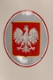 Red and silver enamel sign featuring the Polish Imperial eagle emblem
