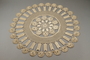 Circular, crocheted, floral and geometric doily owned by Cila Knaster