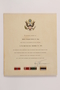 Three ribbon bars on a service certificate awarded posthumously for a US soldier