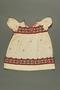 Floral embroidered dress worn by a Jewish baby in Yugoslavia before and during the Holocaust