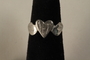 Engraved heart shaped ring crafted from munitions parts and made in secret in a slave labor camp