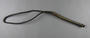 Looped metal whip that may have been used at Auschwitz given to a Ukrainian journalist covering the Nuremberg Trials