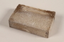 Unused brown soap bar with scratches imprinted RIF 0367